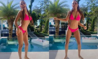 Karol Conká posa de biquíni rosa fazendo dancinha à beira da piscina