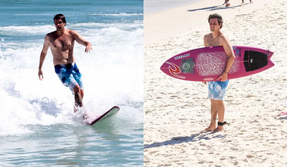 Felipe Dylon curte dia de sol para surfar na praia de Ipanema