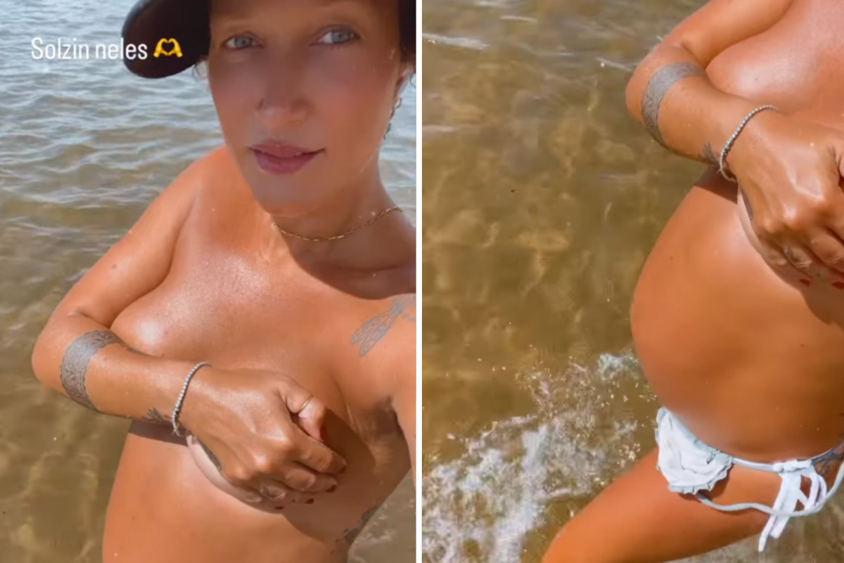 Grávida, Gabriela Pugliesi posa topless para tomar sol na praia