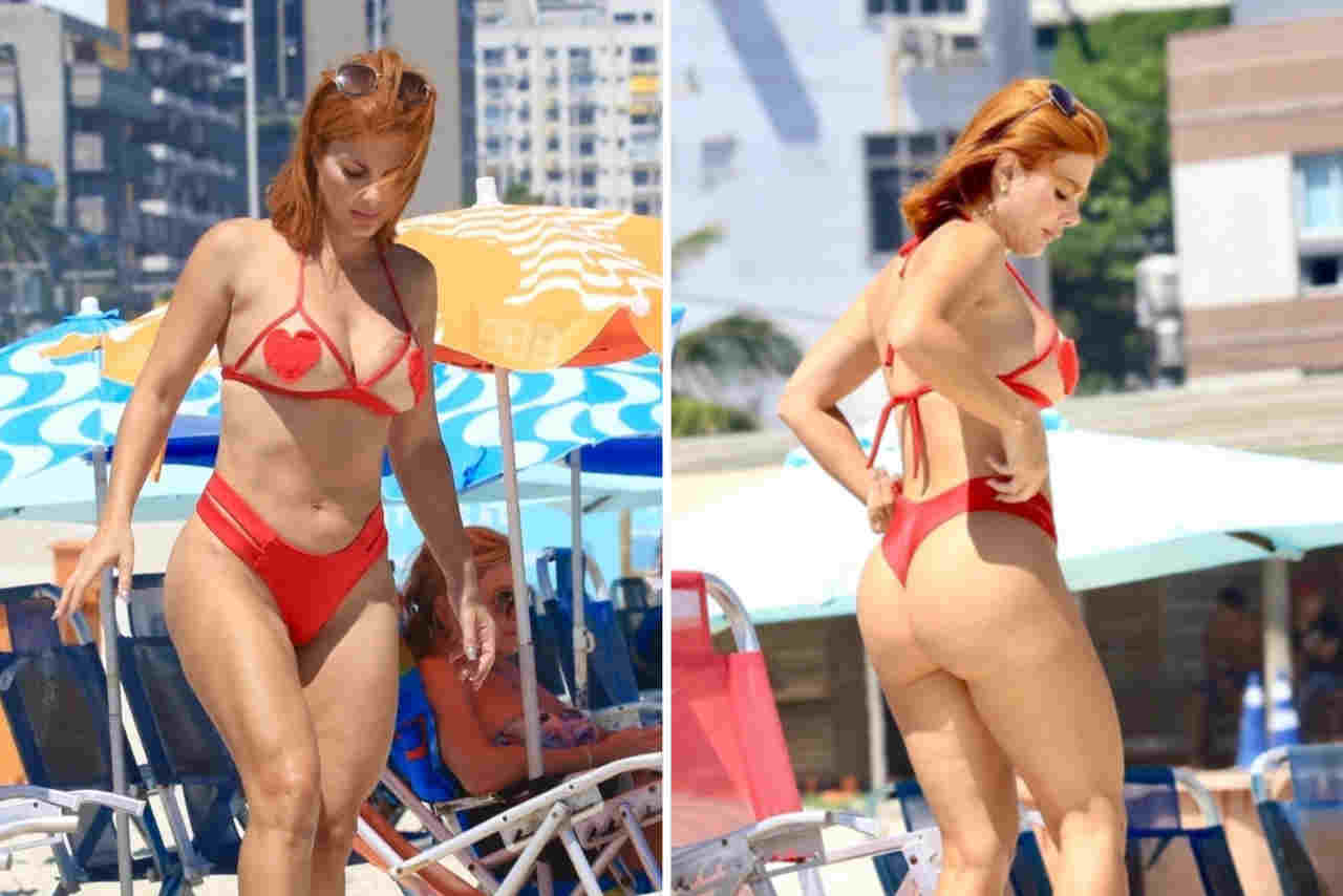 Deborah Albuquerque quase mostra demais em dia de praia no Rio