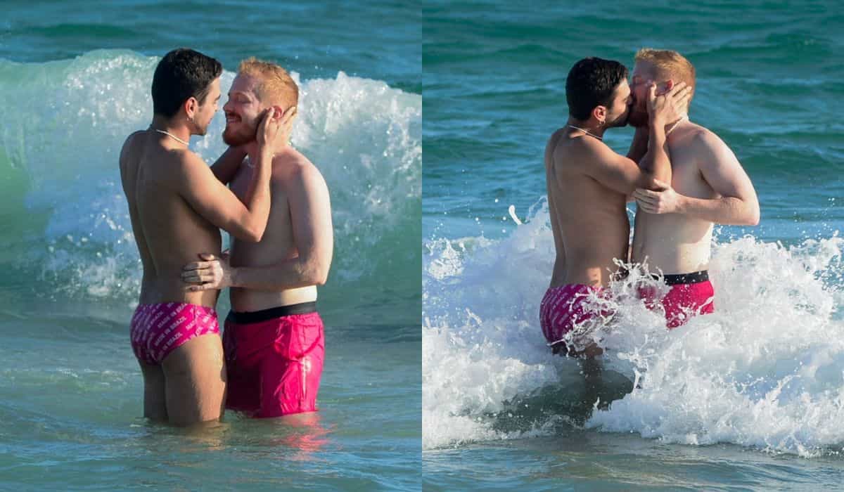 Manoel, ex-Casa de Vidro do BBB 23, troca beijos com marido na praia