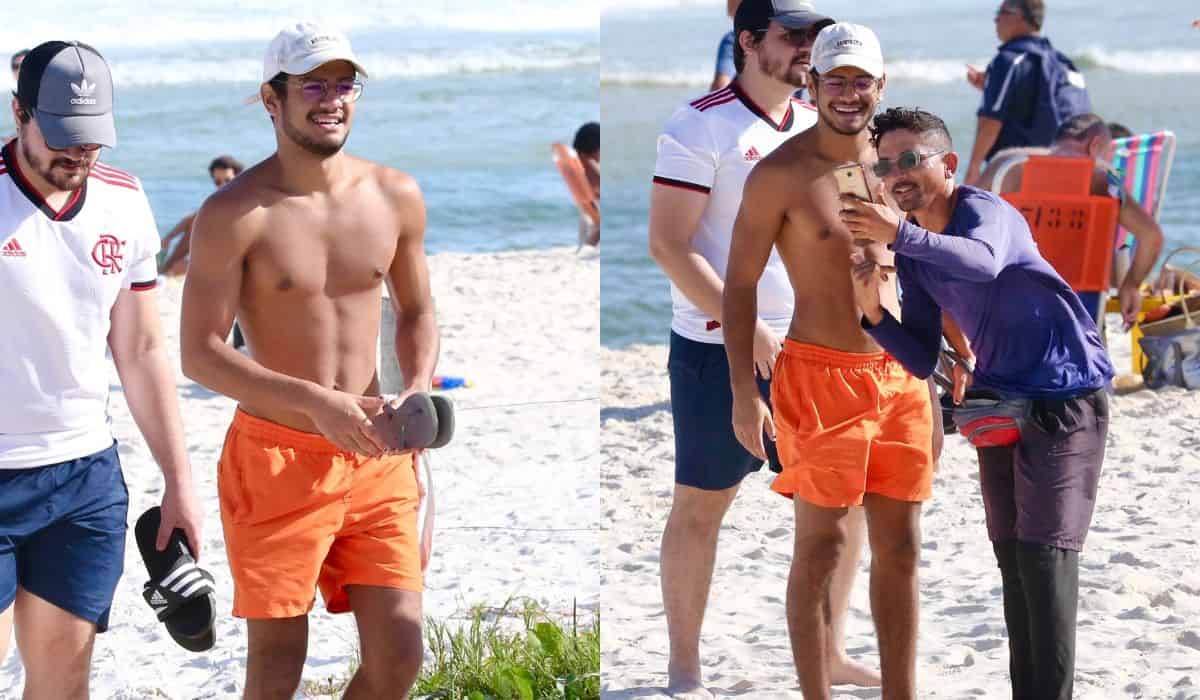 Gabriel Santana tira foto com fãs ao curtir praia no RJ