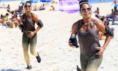 Sorridente, Adriana Bombom faz exercício na praia de Ipanema