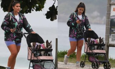 Giulia Costa passeia com o cachorrinho pela orla da Barra da Tijuca