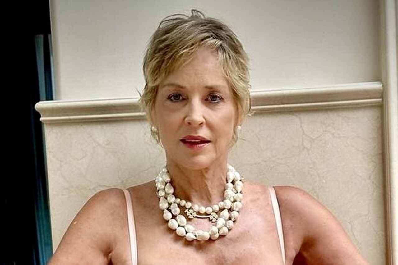 In red lingerie, Sharon Stone has fans drooling as she recreates a scene from 'Basic Instinct'