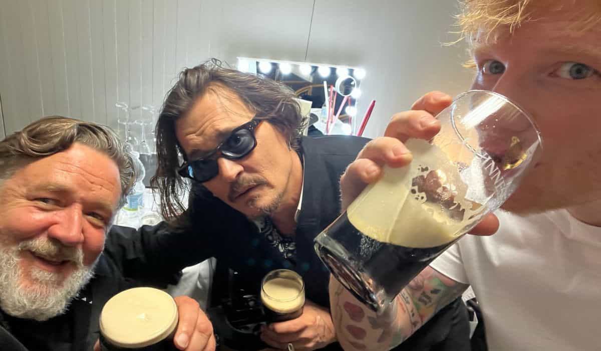 Johnny Depp, Russell Crowe, and Ed Sheeran pose together drinking and surprise fans