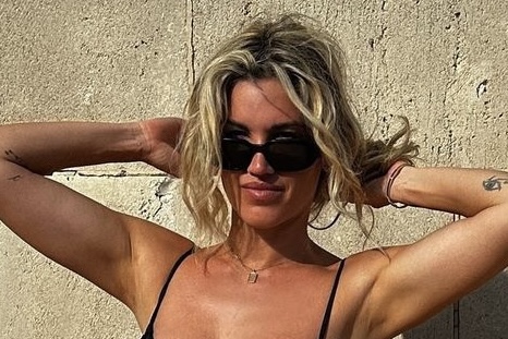 Ashley Roberts raises the temperature after posing in a black bikini